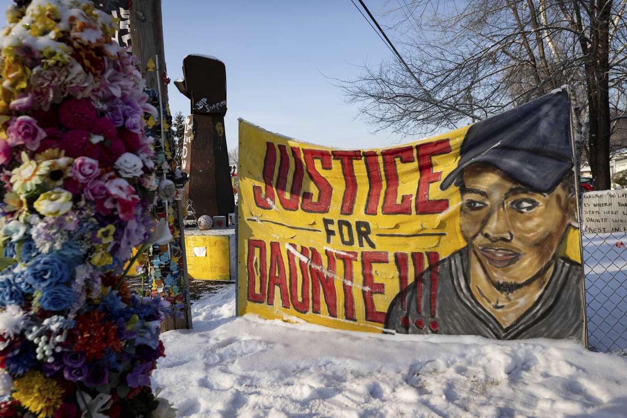 The memorial site for Daunte Wright sits covered in snow on Wednesday, in Brooklyn Center, Minnesota as opening statements begin in the trial for former police officer Kim Potter.