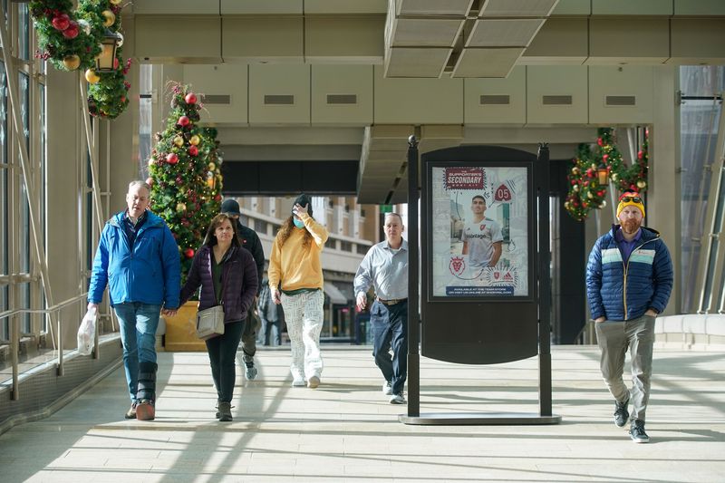 Shoppers walk through at City Creek Center in Salt Lake
City on Wednesday.
