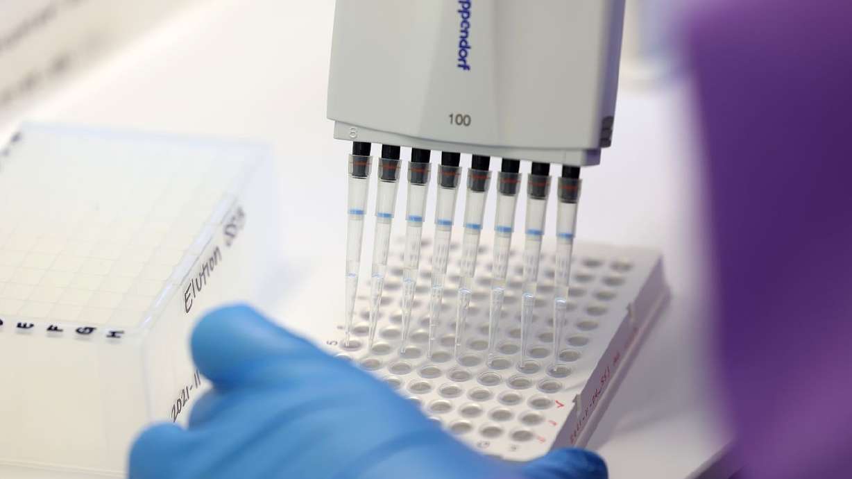 Microbiologist Ann Gariety sequences COVID-19 samples for variants at the Utah Public Health Laboratory in Taylorsville on Nov. 29. Utah health officials reported 1,397 new COVID-19 cases and 10 additional deaths on Thursday.