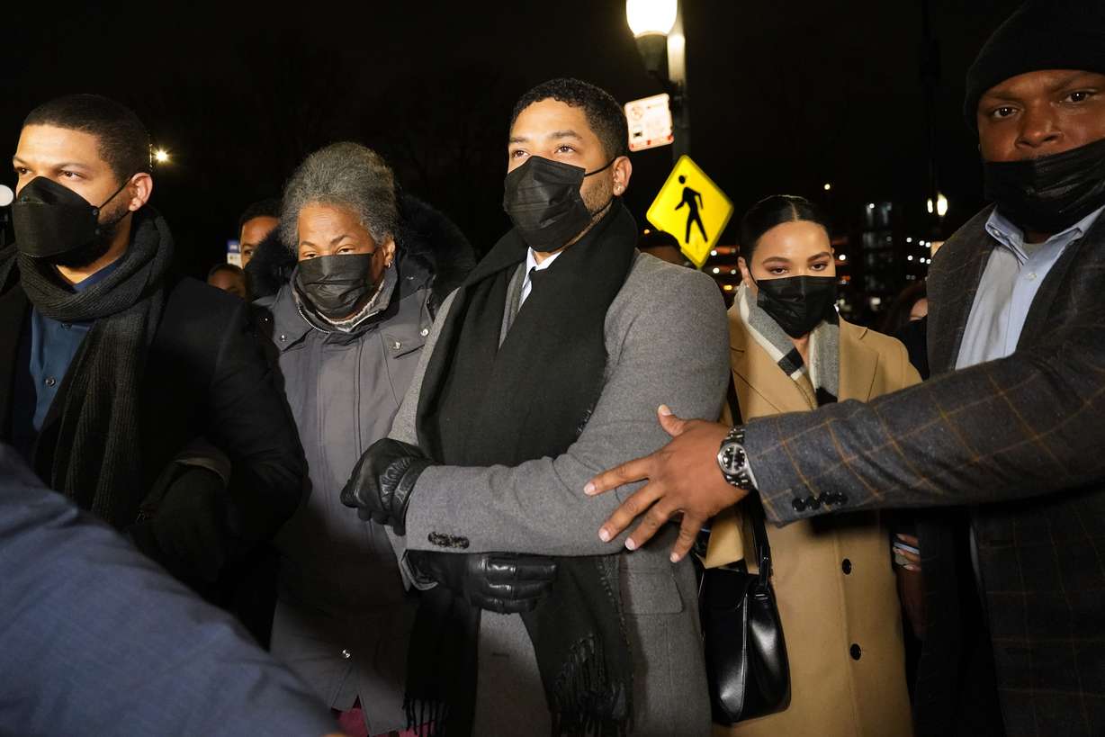 Actor Jussie Smollett, center, along with his mother Janet, second from left, returns to the Leighton Criminal Courthouse, Thursday, in Chicago, after a jury reached a verdict in his trial.