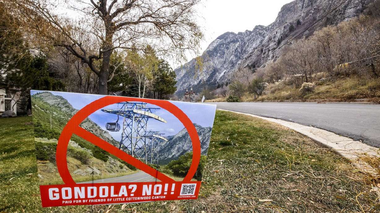 A sign opposed to a gondola is pictured in a yard near
the mouth of Little Cottonwood Canyon in Cottonwood Heights on
Tuesday.