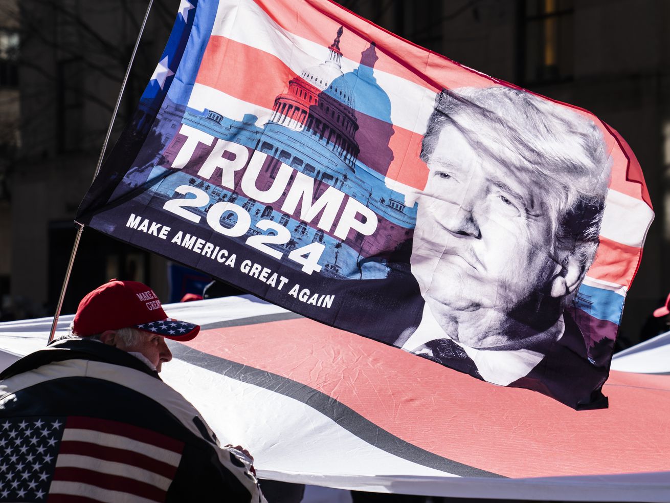 Protesters supporting former President Donald Trump march down Fifth Avenue on their way toward Times Square in New York on March 5. New Utah poll looks at who would vote for Trump in 2024.