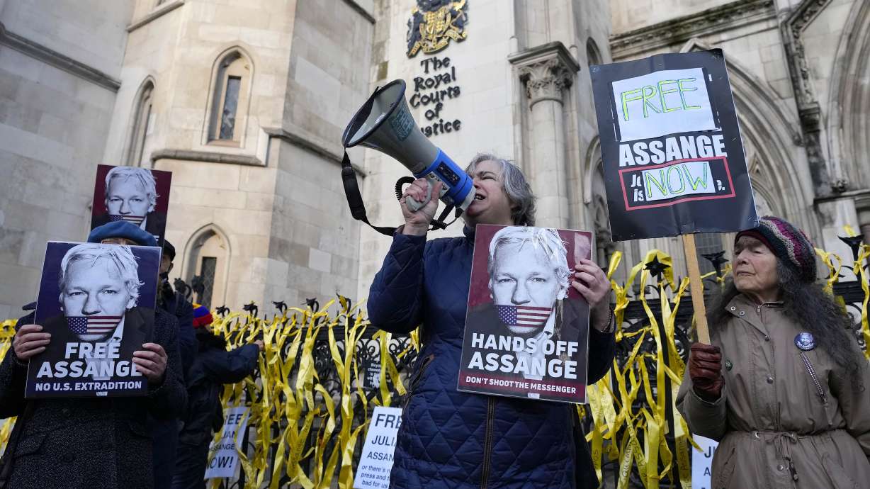 Protestors demonstrate outside the High Court in London, Friday. A British appellate court has opened the door for WikiLeaks founder Julian Assange to be extradited to the United States on espionage charges.