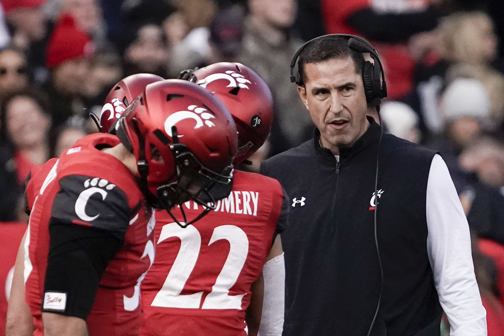 Cincinnati head coach Luke Fickell, right, stands on the sidelines during the first half of the American Athletic Conference championship NCAA college football game against Houston Saturday, Dec. 4, 2021, in Cincinnati.