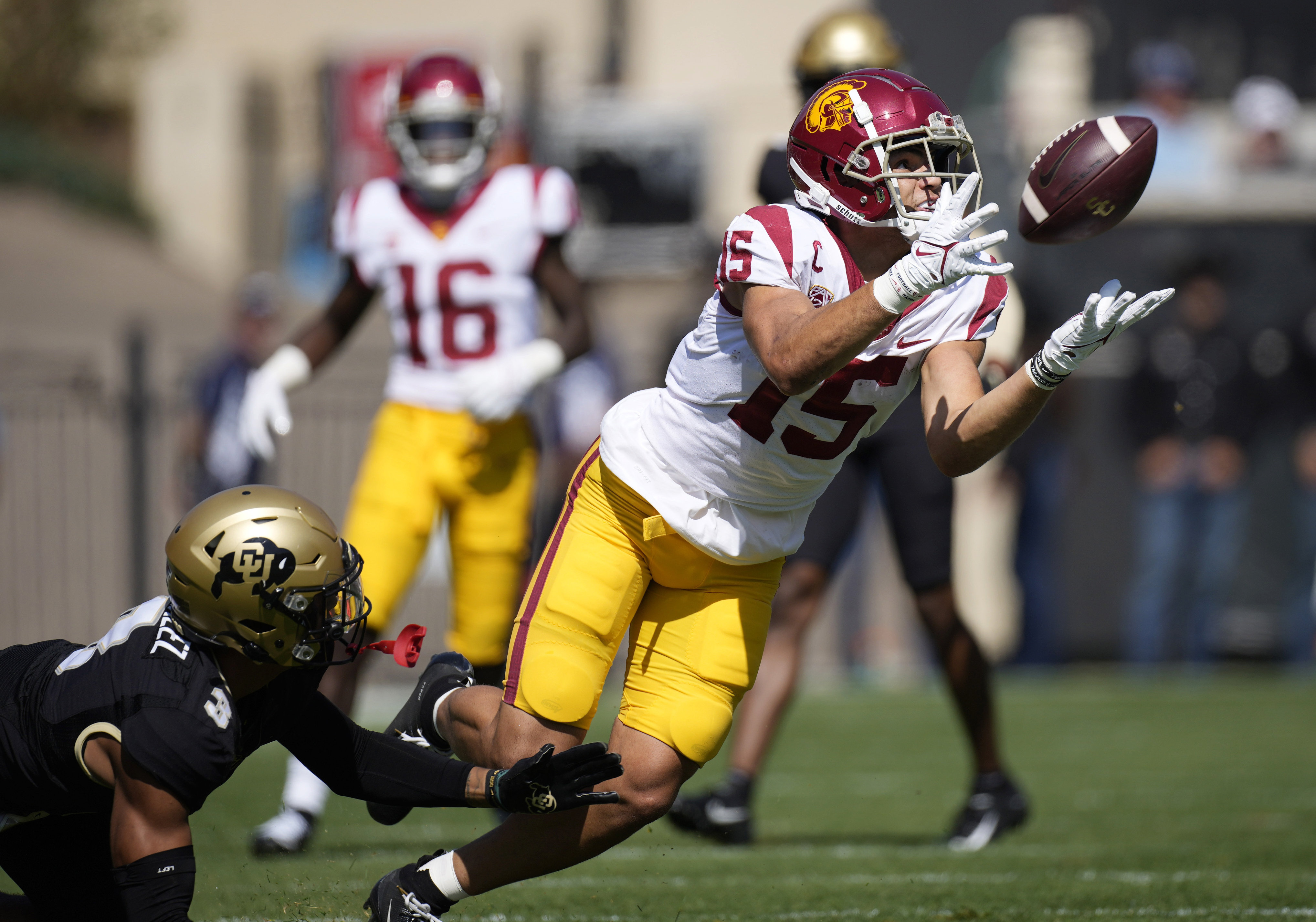 Southern California wide receiver Drake London, right, pulls in a pass as Colorado cornerback Christian Gonzalez defends during the first half of an NCAA college football game Oct. 2, 2021, in Boulder, Colo. London was named The Associated Press Pac-12 Offensive Player of the Year.