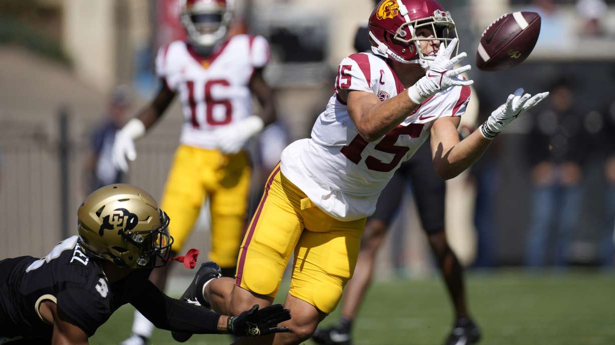 Southern California wide receiver Drake London, right, pulls in a pass as Colorado cornerback Christian Gonzalez defends during the first half of an NCAA college football game Oct. 2, 2021, in Boulder, Colo. London was named The Associated Press Pac-12 Offensive Player of the Year.