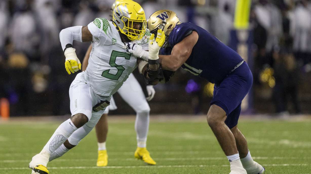 Oregon defensive end Kayvon Thibodeaux rushes the passer as Washington offensive lineman Jaxson Kirkland blocks during an NCAA college football game Nov. 6, 2021, in Seattle. Thibodeaux was voted to The Associated Press All Pac-12 team, in results announced Friday, Dec. 10.