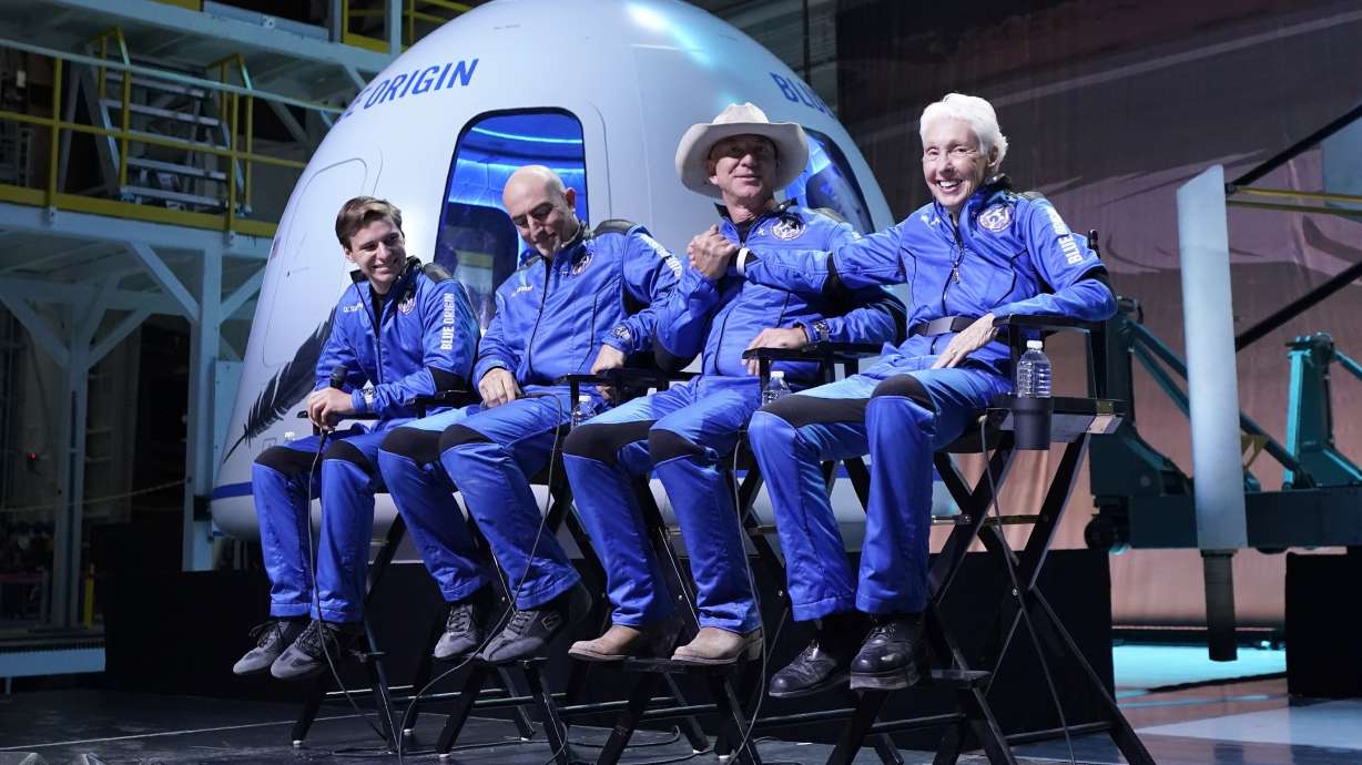 Oliver Daemen, from left, Mark Bezos, Jeff Bezos, founder of Amazon and space tourism company Blue Origin, and Wally Funk, right, participates in a post launch briefing where they discussed their flight experience aboard the Blue Origin New Shepard rocket at its spaceport near Van Horn, Texas, on July 20.