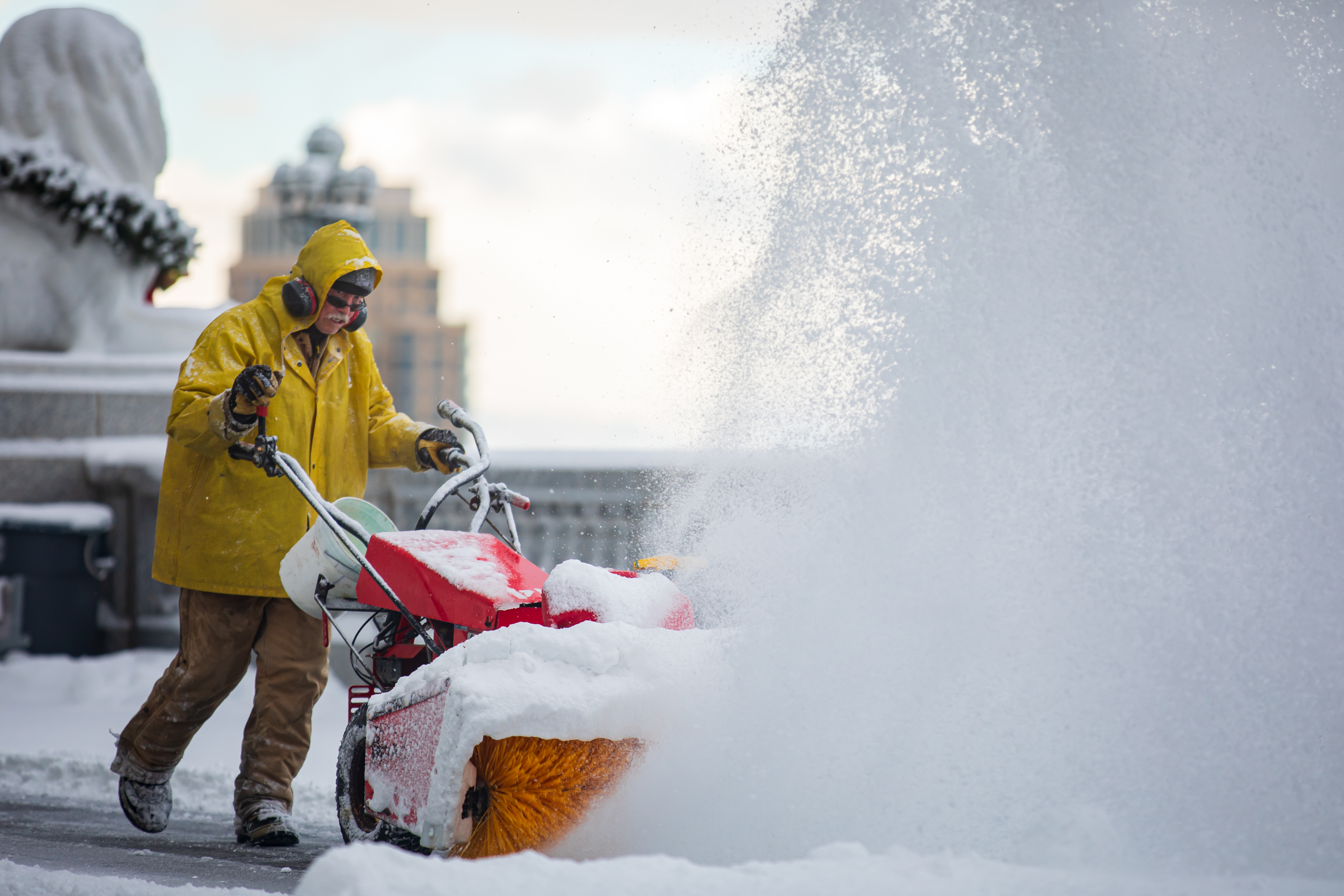 Workers clear snow at the Utah Capitol on Friday. Some parts of the city received over 3 inches of snow, while some parts of the state received over 2 feet of snow since late Wednesday.