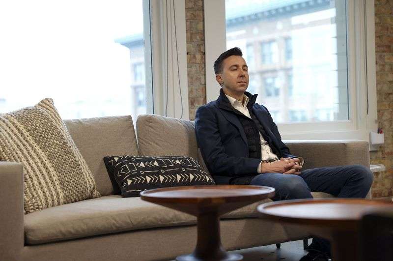 Ryan Westwood, Simplus CEO, meditates between meetings
in his office in Salt Lake City on Thursday.