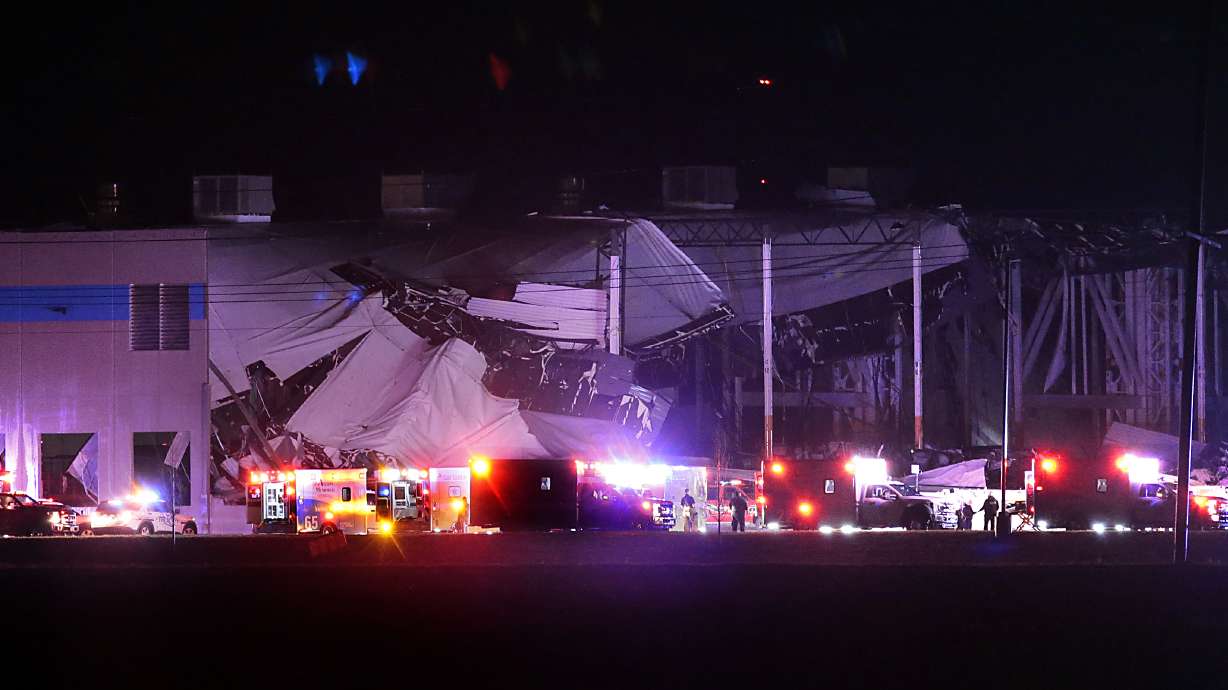 The Amazon distribution center is partially collapsed after being hit by a tornado on Friday in Edwardsville, Ill.