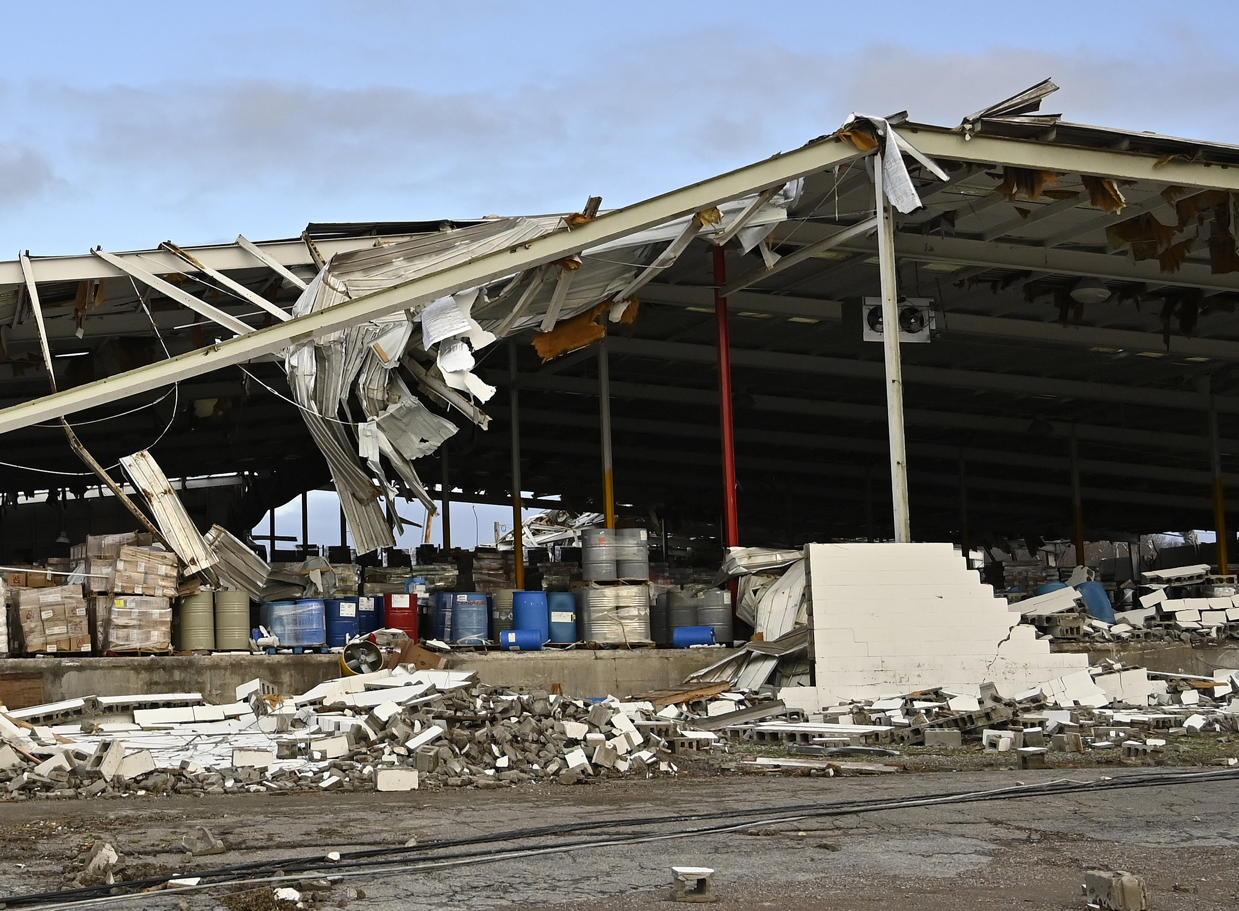 A feed store damaged by a tornado is seen in Mayfield, Ky.,on Saturday. Tornadoes and severe weather caused catastrophic damage across multiple states late Friday, killing several people overnight.