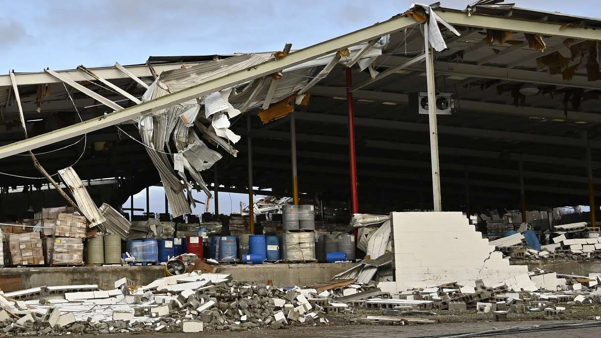 A feed store damaged by a tornado is seen in Mayfield, Ky.,on Saturday. Tornadoes and severe weather caused catastrophic damage across multiple states late Friday, killing several people overnight.