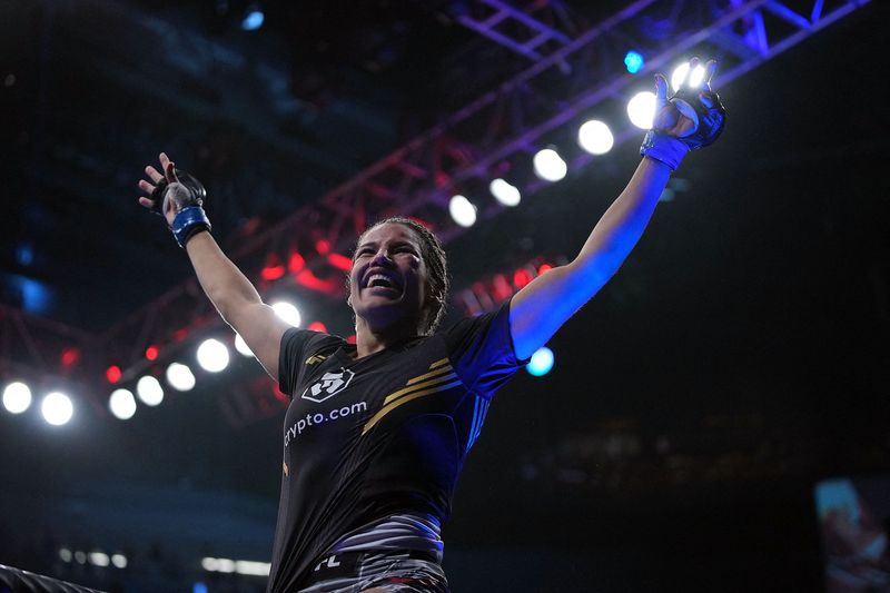 Julianna Pena celebrates her victory by submission against Amanda Nunes during UFC 269 at T-Mobile Arena, Dec. 11, 2021 in Las Vegas, Nevada.