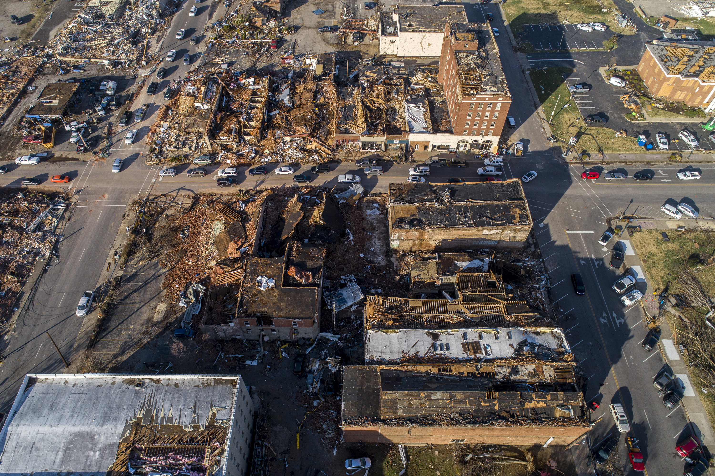 In this photo taken by a drone, buildings are demolished in downtown Mayfield, Ky., on Saturday, after a tornado traveled through the region Friday night.