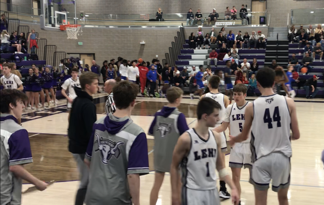 Lehi's Cooper Lewis (1) and Spencer Anderson (5) after the Pioneers' 60-51 win over Norland (Florida) at Holiday Hoopfest, Saturday, Dec. 11, 2021 at Lehi High School.