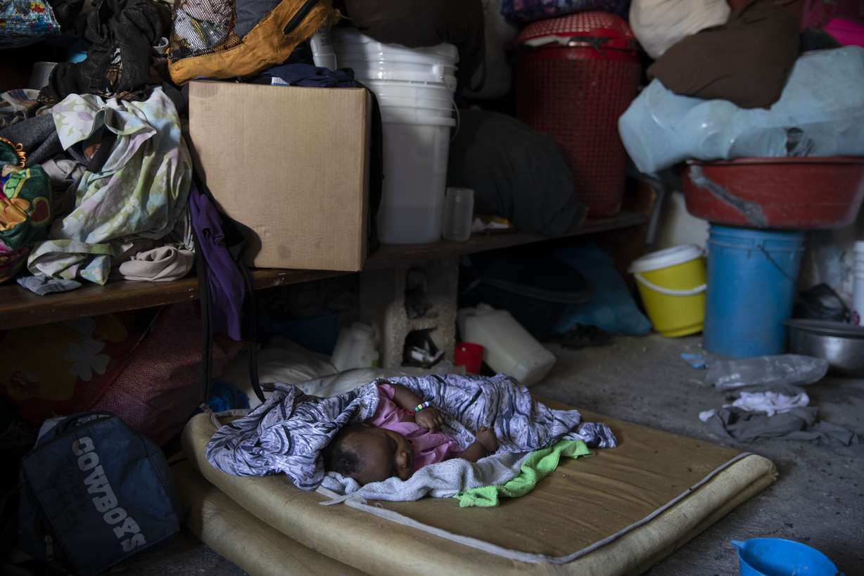 A baby sleeps at a shelter for families displaced by gang violence in Port-au-Prince, Haiti, Thursday. According to the United Nations Integrated Office in Haiti, "Rapes, murders, thefts, armed attacks, kidnappings continue to be committed daily, on populations often left to fend for themselves in disadvantaged and marginalized neighborhoods of Port-au-Prince and beyond."