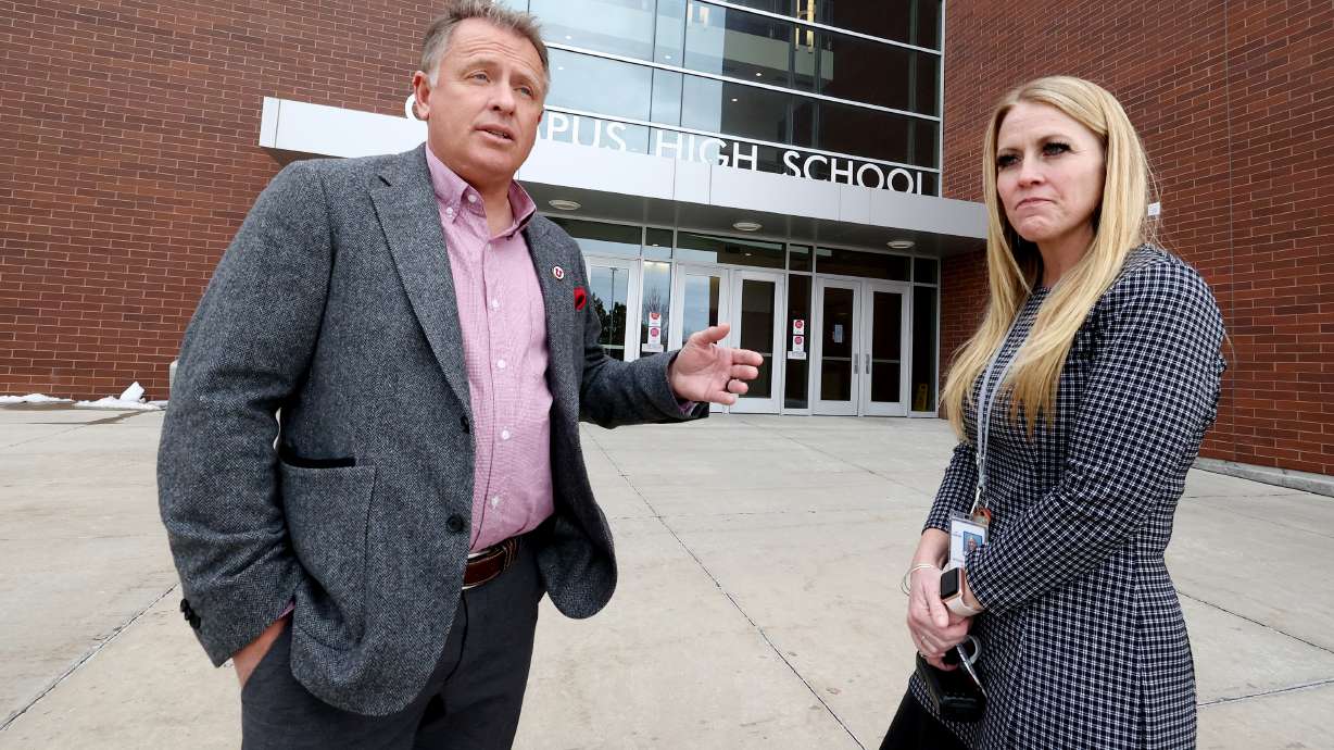 University of Utah President Taylor Randall and Olympus High School Principal Jen Christensen talk on Monday after taking part in an announcement at Olympus High in Holladay of the Guarantee scholarship that will offer aid to at least 700 Utah students.