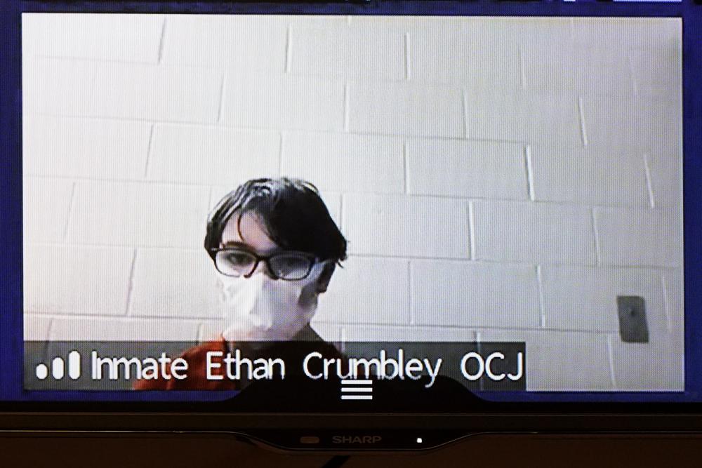 Ethan Crumbley appears on video from the Oakland County Jail at 52nd District Court in Rochester Hills, Mich., Monday. Crumbley, 15, is charged as an adult with murder, terrorism and other counts for the Nov. 30 shooting at Oxford High School.