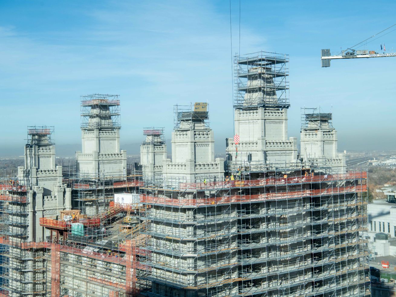 Workers are removing and cataloging stone from the
eastern towers and walls of the Salt Lake Temple as part of a
process of repairs and restoration seen in this image taken from
the Joseph Smith Memorial Building in Salt Lake City in December
2021.