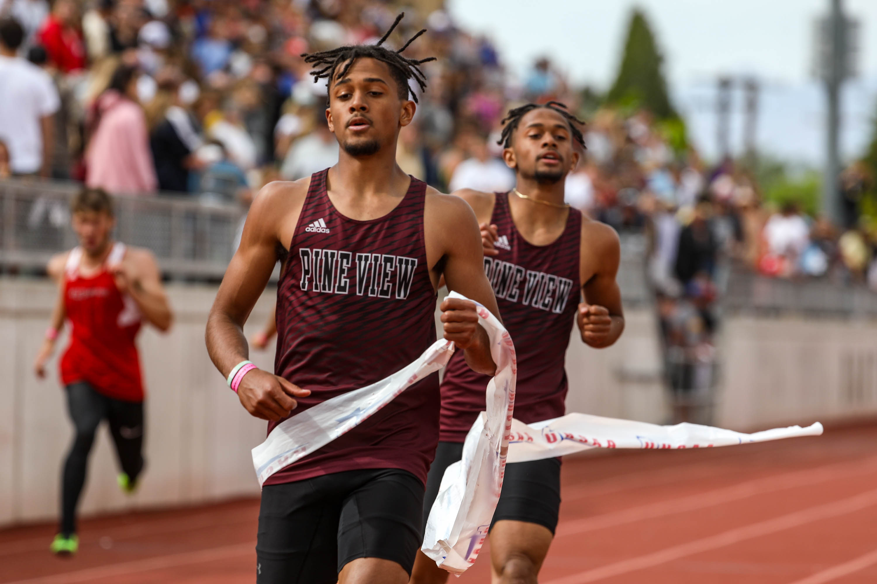 Pine View’s Marcus Mckenzie, left, and Dominique Mckenzie, right, compete in the boys 200 meters 4A final in the state track and field championships in Kaysville on Saturday, May 22, 2021.
