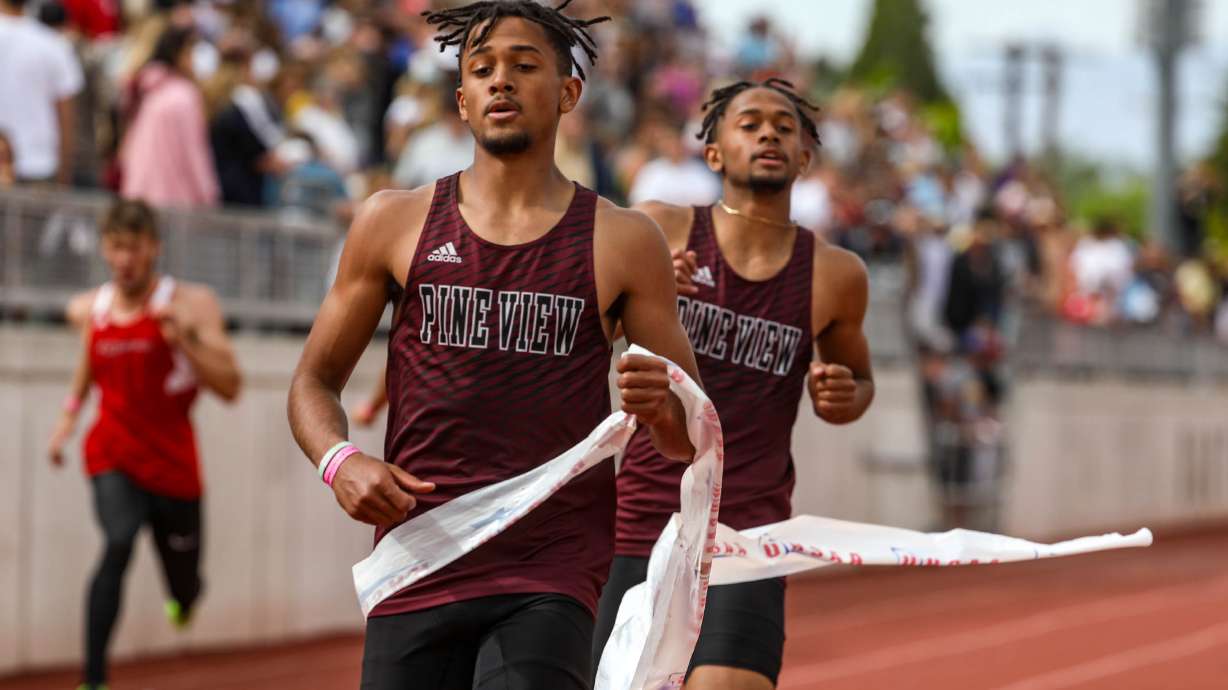 Pine View’s Marcus Mckenzie, left, and Dominique Mckenzie, right, compete in the boys 200 meters 4A final in the state track and field championships in Kaysville on Saturday, May 22, 2021.