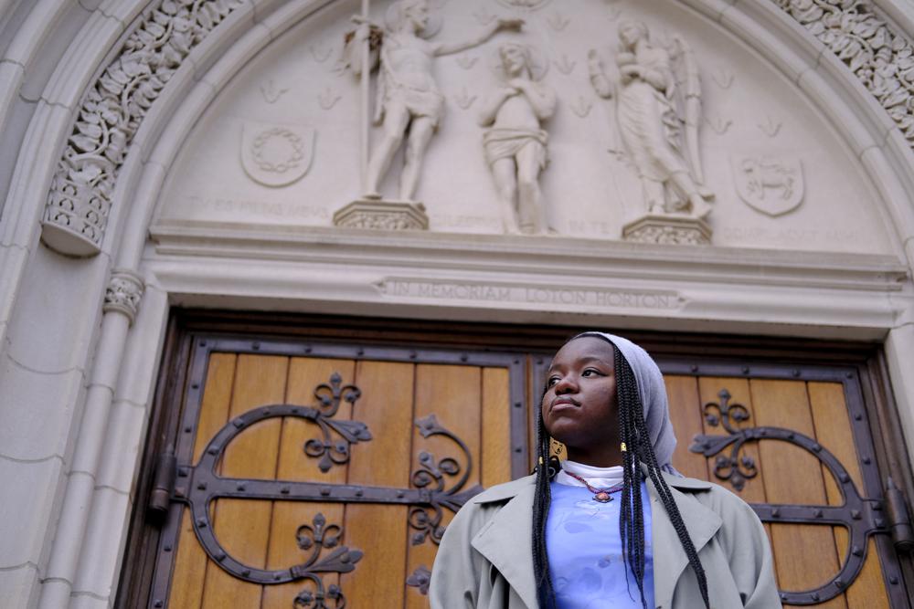 Nathalie Charles poses for a portrait outside the Princeton University Chapel in Princeton, N.J. on Dec. 8. Charles left her Baptist church at the age of 15.