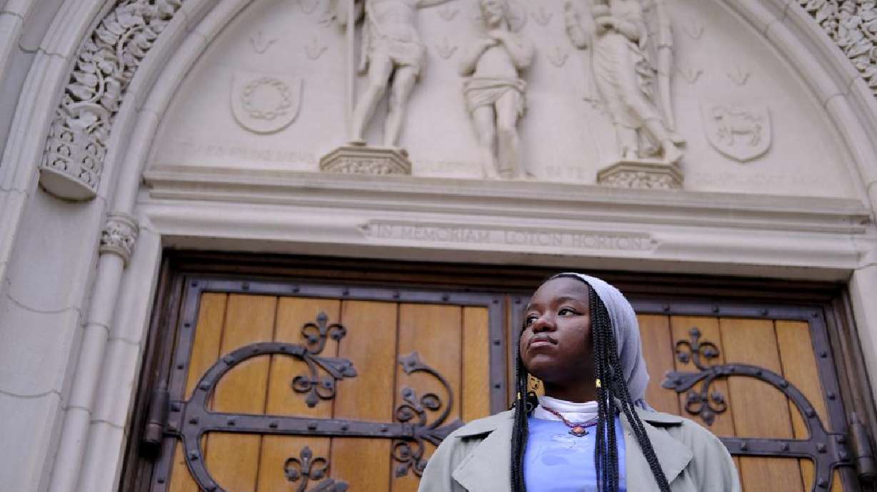 Nathalie Charles poses for a portrait outside the Princeton University Chapel in Princeton, N.J. on Dec. 8. Charles left her Baptist church at the age of 15.