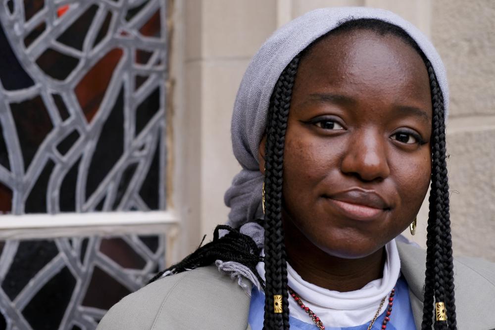 Nathalie Charles poses for a portrait outside the Princeton University Chapel in Princeton, N.J. on Wednesday, Dec. 8, 2021. The 18-year-old freshman at Princeton had identified as atheist, and then agnostic, before embracing a spiritual but not religious life.
