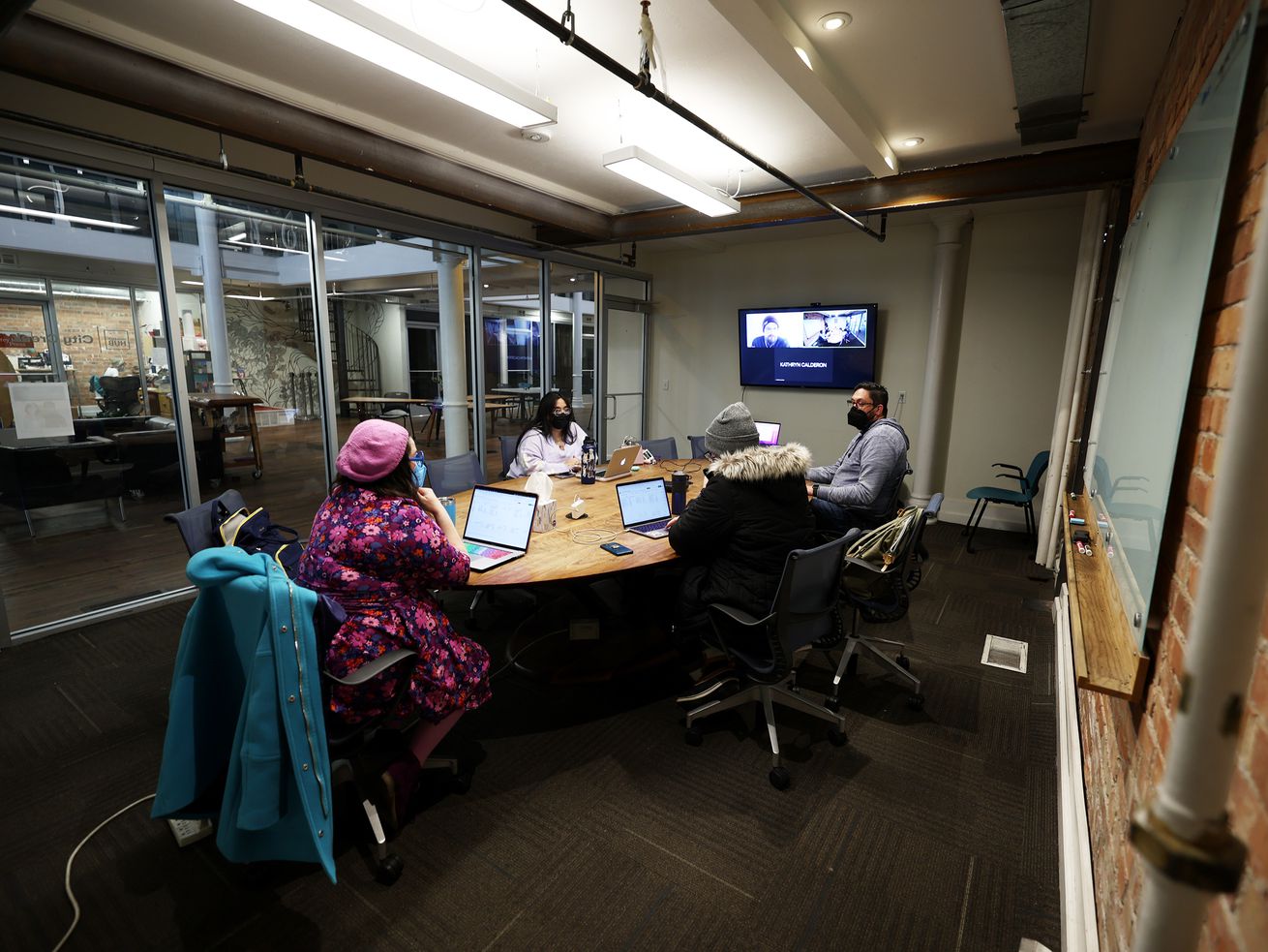 Workers from small companies work at co-working space Impact Hub in Salt Lake City on Tuesday. 