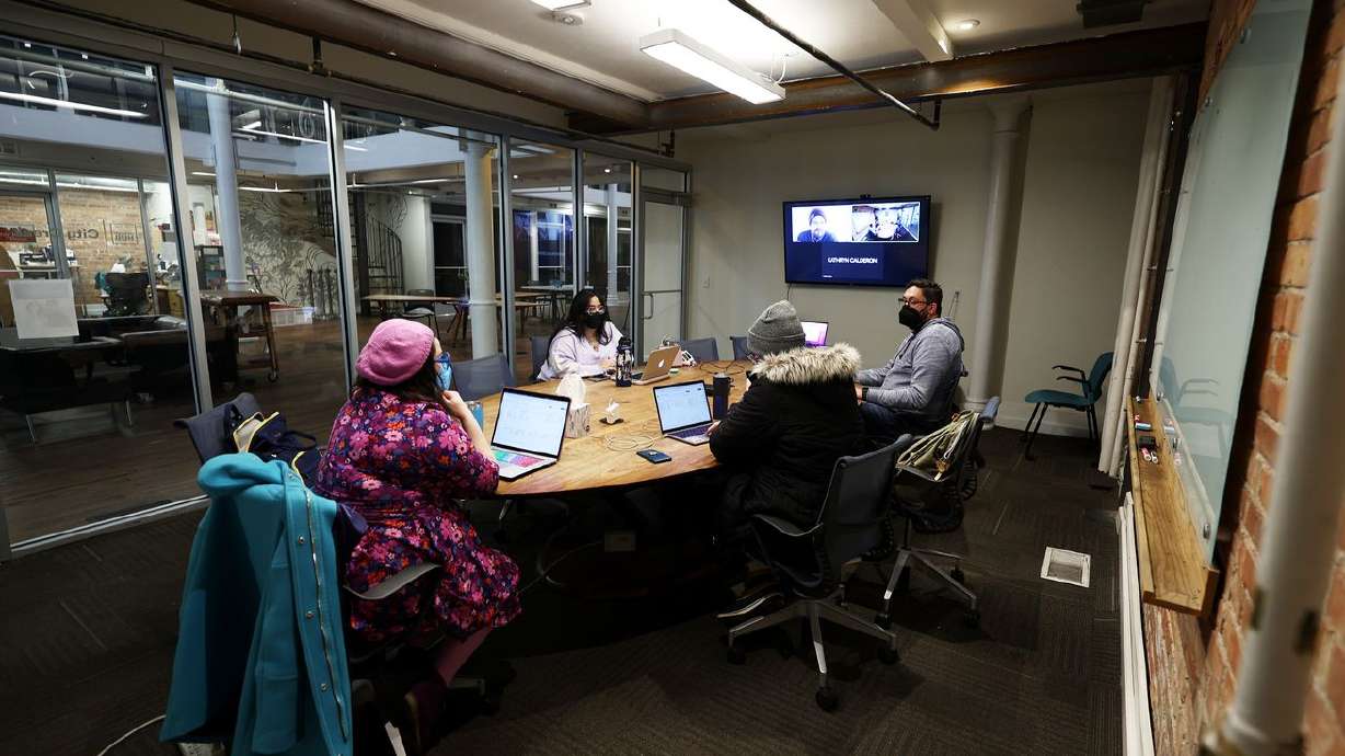 Workers from small companies work at co-working space Impact Hub in Salt Lake City on Tuesday.