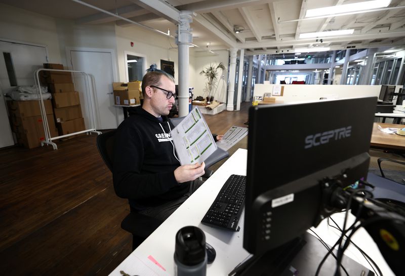 Rob Vorwald, fleet supervisor at Greenbike, works at
the co-working space Impact Hub in Salt Lake City on Tuesday.