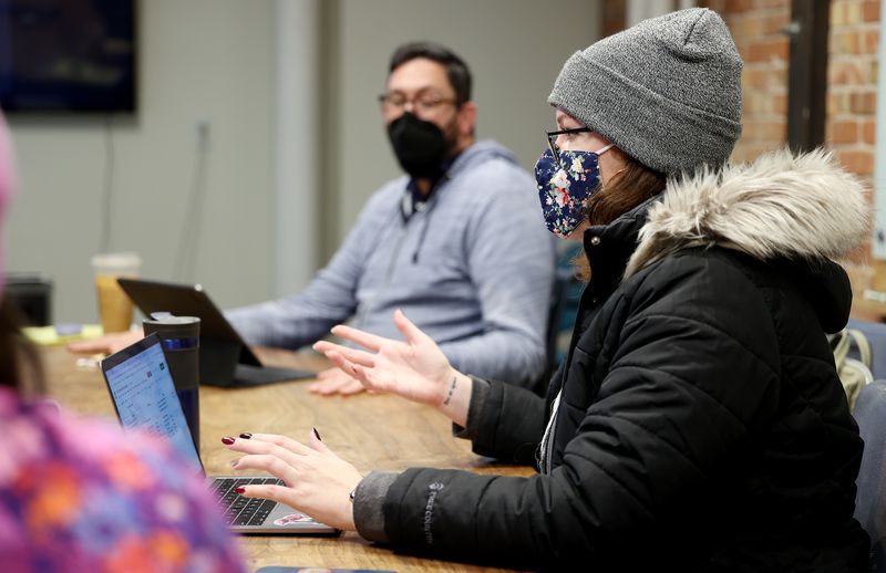 Chase Thomas, executive director of Alliance for a
Better Utah, left, listens as Katie Matheson, the alliance’s deputy
director, talks as they attend a video meeting at the co-working
space Impact Hub in Salt Lake City on Tuesday.