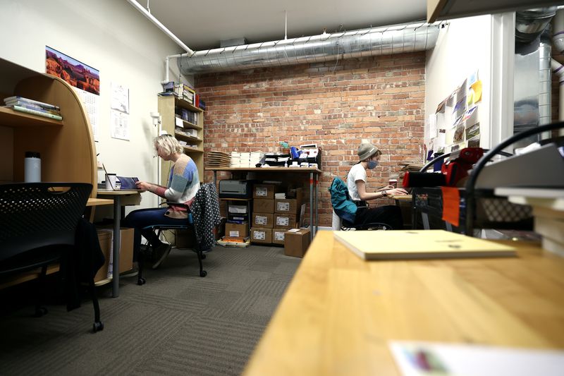 Intern Sunny Carlstrom, left, and Rachel Buck-Cockayne,
production manager at Torrey House Press, work at the co-working
space Impact Hub in Salt Lake City on Tuesday.