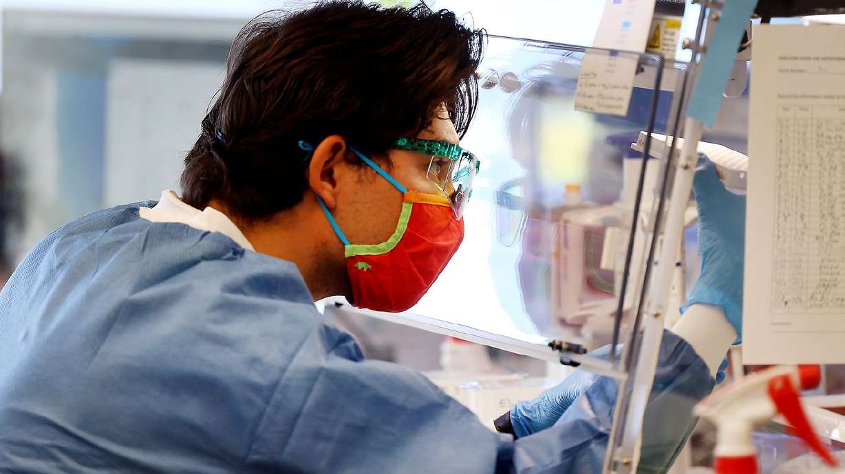 Microbiologist Samuel Philips sequences COVID-19 samples for variants at the Utah Public Health Laboratory in Taylorsville on Nov. 29.