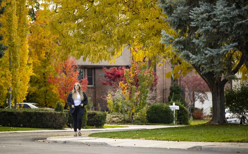 Alexa Minson walks near her home as she poses for
photos in Orem on Tuesday, Nov. 2.