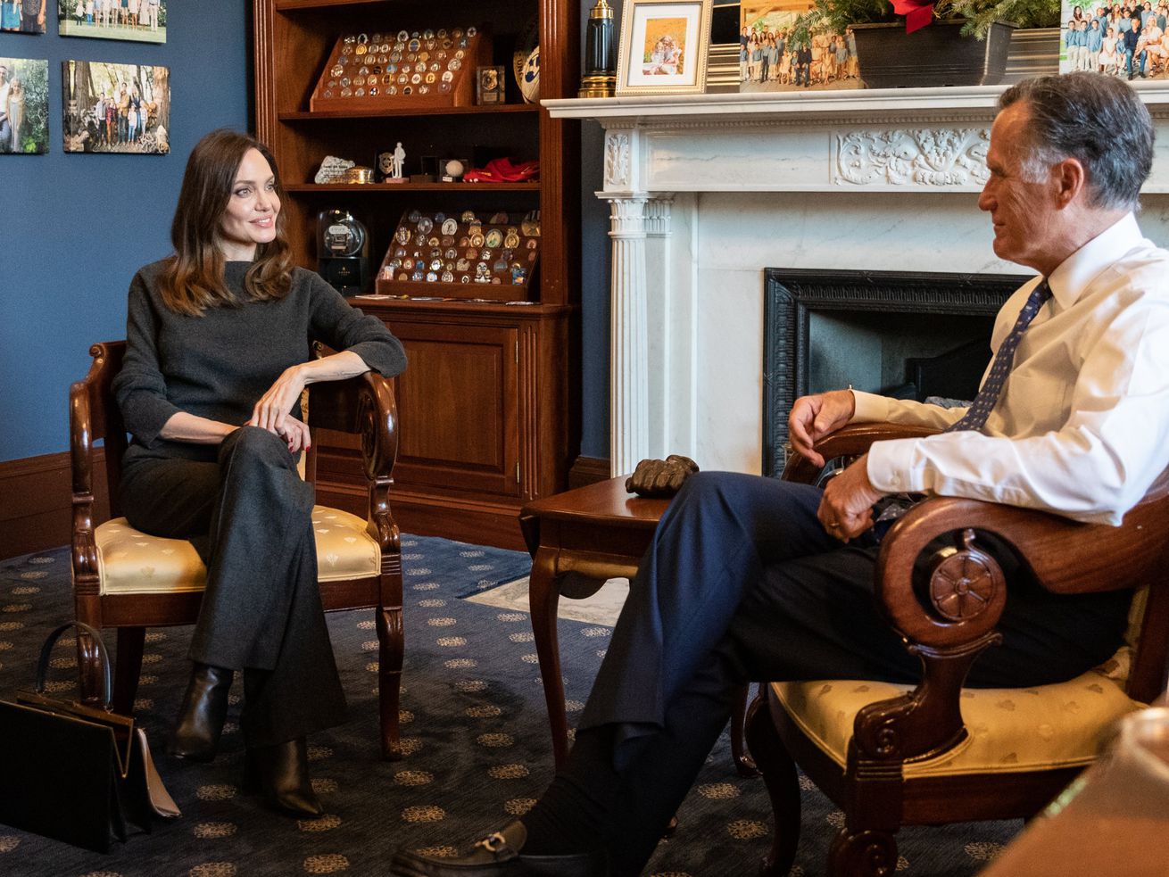 Actress Angelina Jolie, left, is pictured with Sen. Mitt Romney, R-Utah, in a photo posted to Twitter on Tuesday.