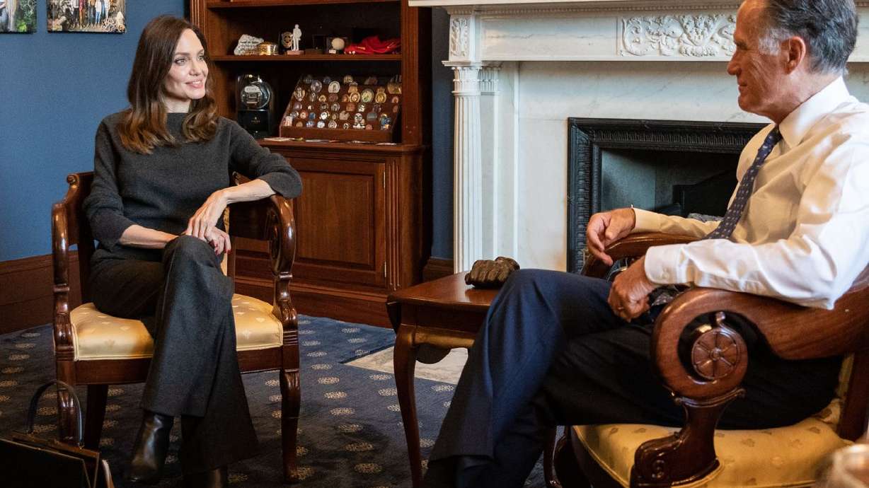 Actress Angelina Jolie, left, is pictured with Sen. Mitt Romney, R-Utah, in a photo posted to Twitter on Tuesday.