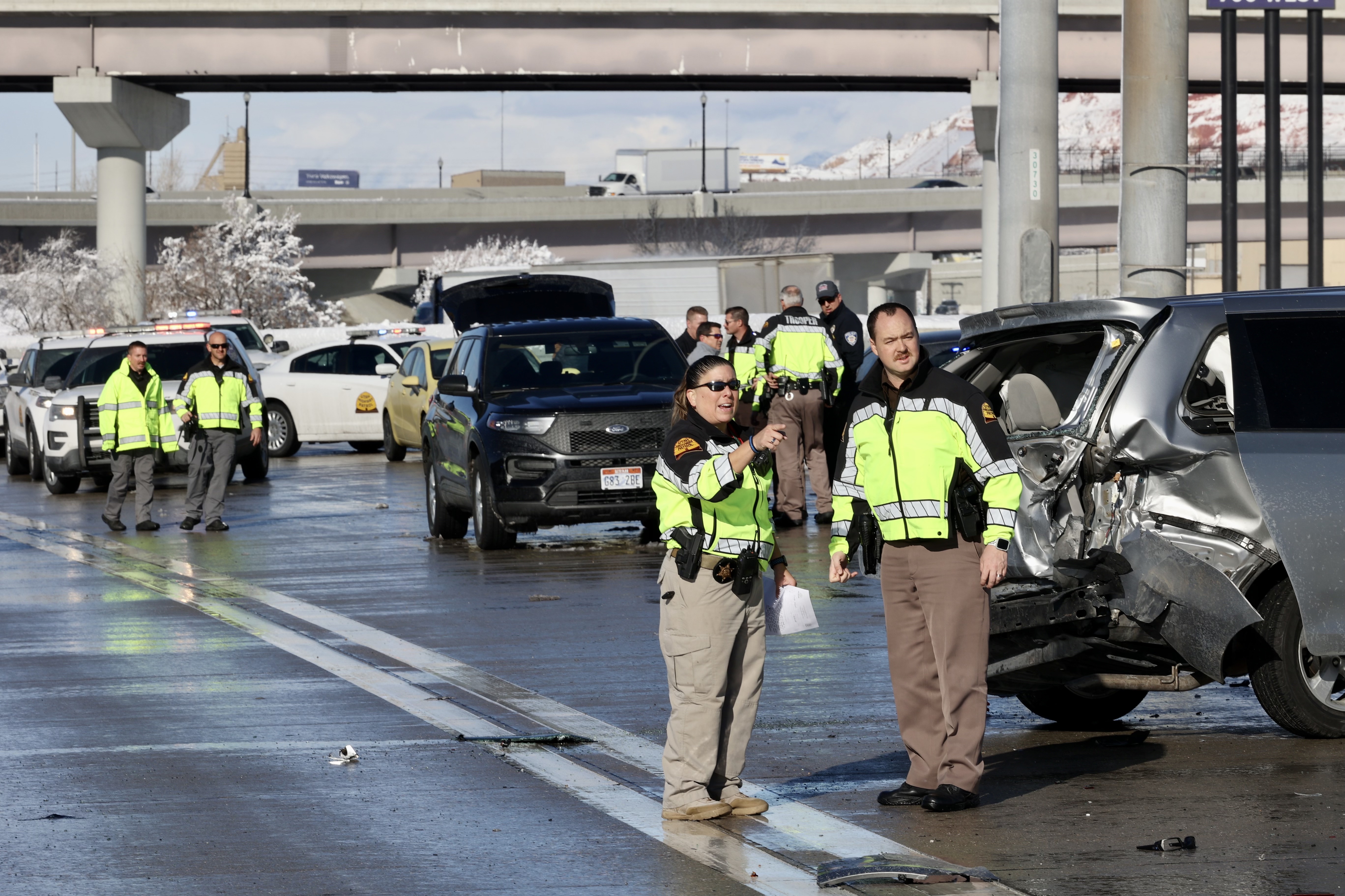 Police investigate a crash on I-15 and 700 South in Salt Lake City on Wednesday. The crash injured two law enforcement officers.