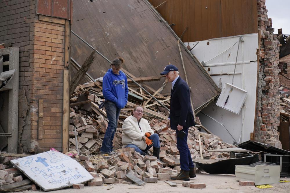 President Joe Biden surveys storm damage from tornadoes and extreme weather in Mayfield, Ky., Wednesday.