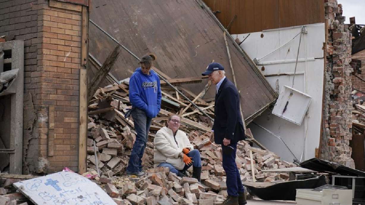 President Joe Biden surveys storm damage from tornadoes and extreme weather in Mayfield, Ky., Wednesday.