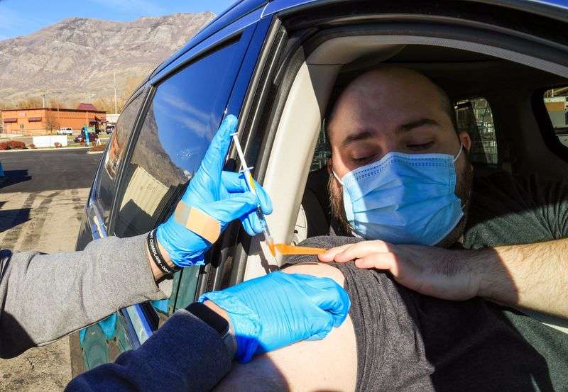 Tanner Davies receives a COVID-19 vaccination at a
NOMI/TestUtah vaccination site in Lindon on Tuesday, Nov. 23.