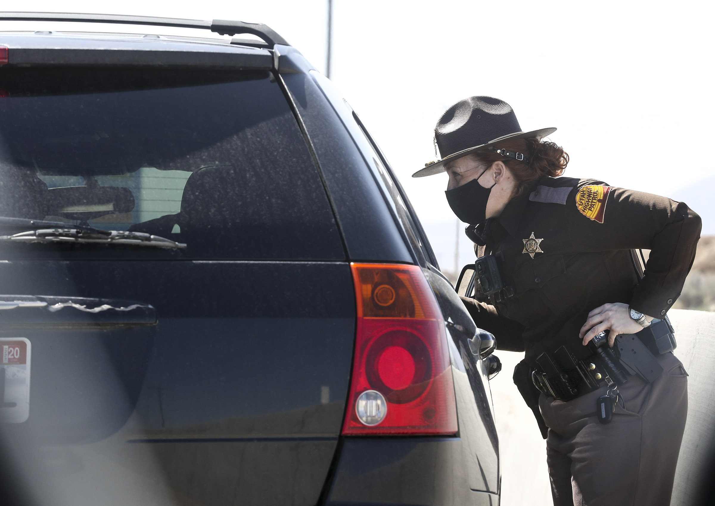 Utah Highway Patrol trooper Geri Tew speaks with a motorist after pulling them over on I-15 near Lehi on April 8. On Thursday,  UHP kicked off its annual holiday campaign encouraging motorists not to drink and drive. The theme of this year's campaign is:  Every sip has a consequence.