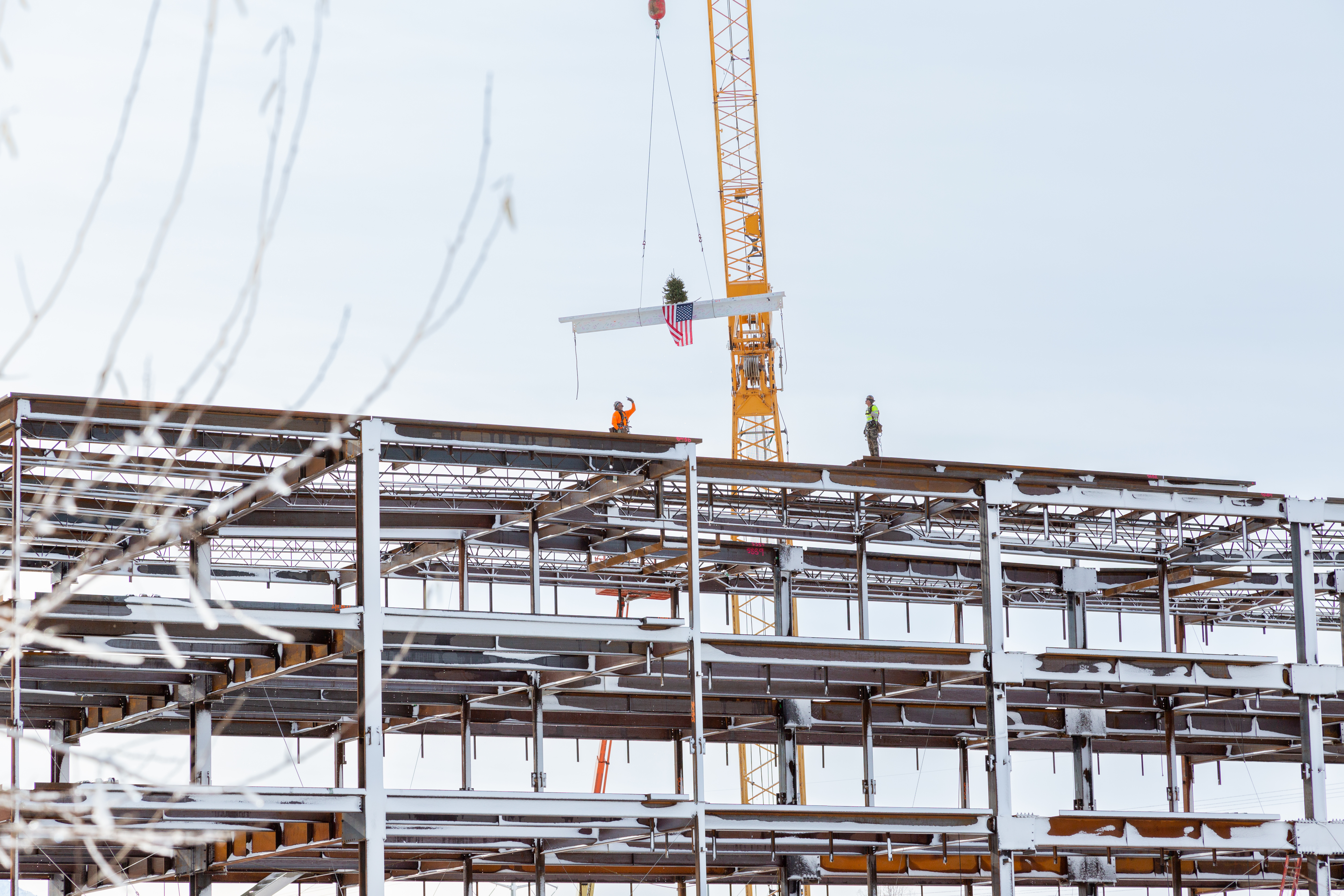 A final beam is placed on the future Noorda College of Osteopathic Medicine. The beam was placed in a "topping off" ceremony on Tuesday.
