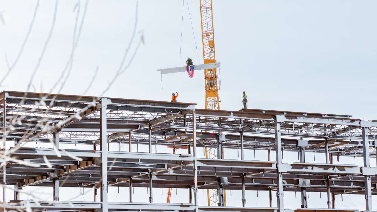A final beam is placed on the future Noorda College of Osteopathic Medicine. The beam was placed in a "topping off" ceremony on Tuesday.
