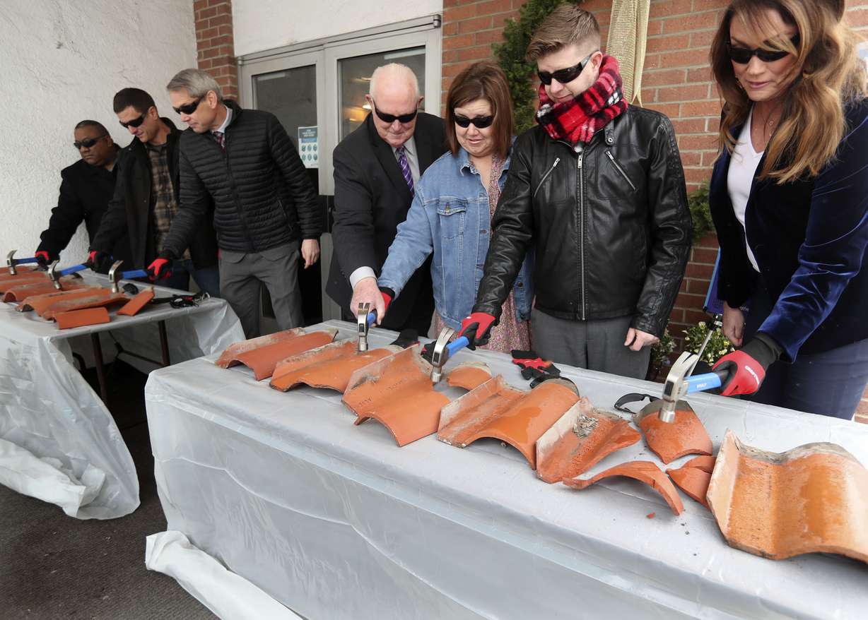 Roof tiles are ceremoniously smashed as the Provo Community Congregational United Church of Christ kicks off the first phase of its Community Cornerstone Restoration Project in Provo on Thursday.