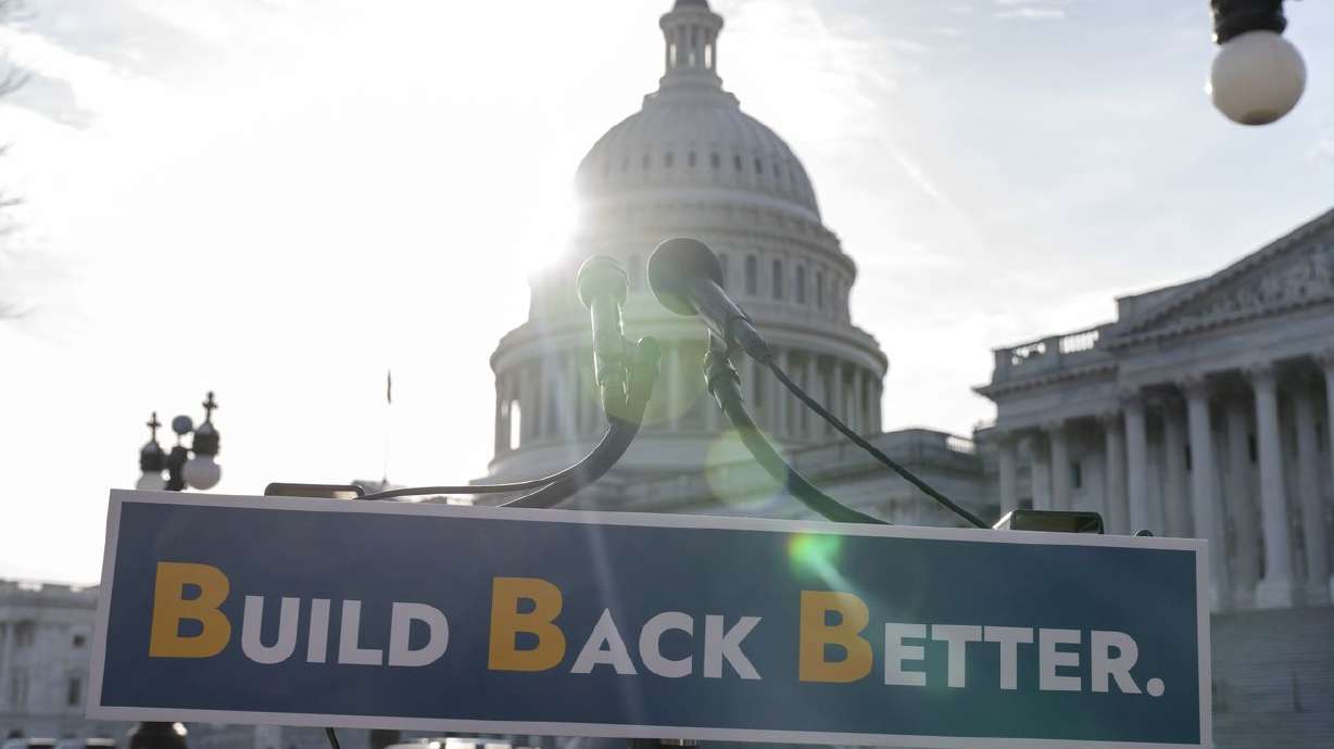 With the U.S. Capitol dome in the background, a sign
that reads "Build Bake Better” is displayed before a news
conference, Wednesday, on Capitol Hill in
Washington.