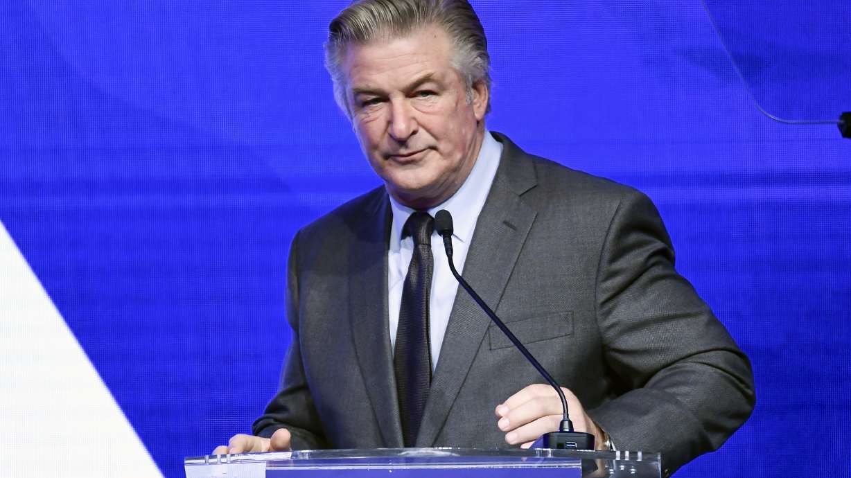 Alec Baldwin performs emcee duties at the Robert F. Kennedy Human Rights Ripple of Hope Award Gala on Dec. 9 in New York. Authorities on Thursday issued a search warrant for Baldwin's cell phone.