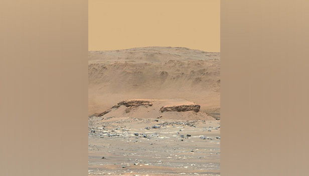 Perseverance took this photo of Jezero Crater in April. The flat-topped hill, named Kodiak, has ancient layered rocks.