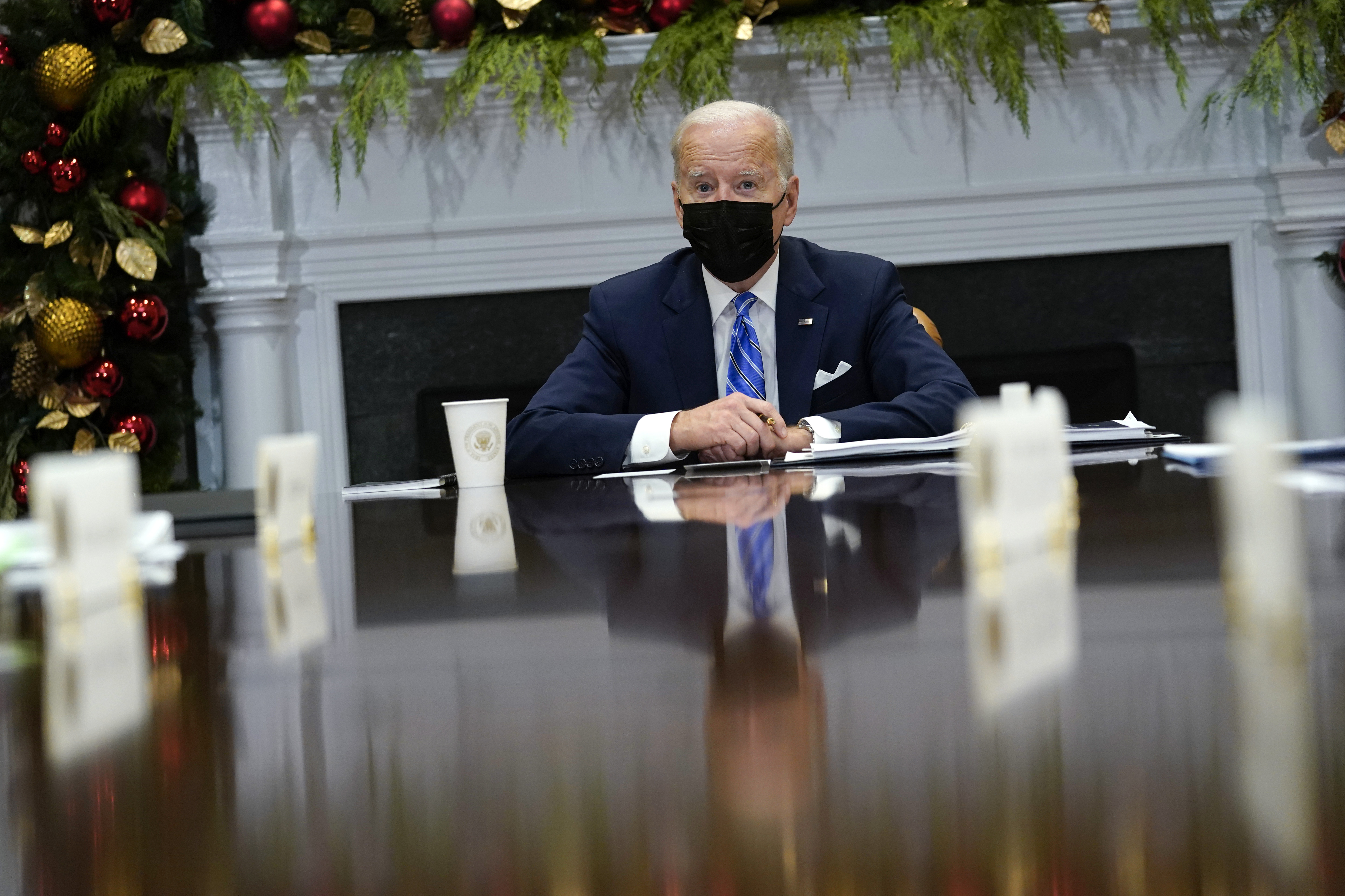 President Joe Biden meets with members of the White House COVID-19 Response Team in Washington Thursday. He has all but acknowledged negotiations over his sweeping domestic policy package will likely push into the new year.